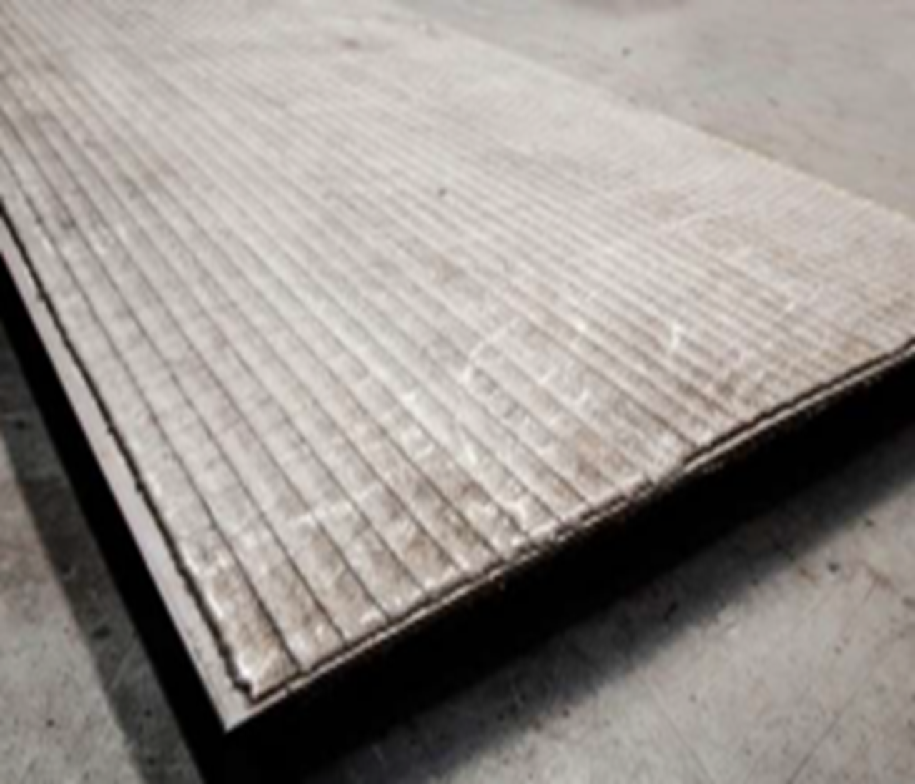 WELD CLADDED WEAR RESISTANT PLATES